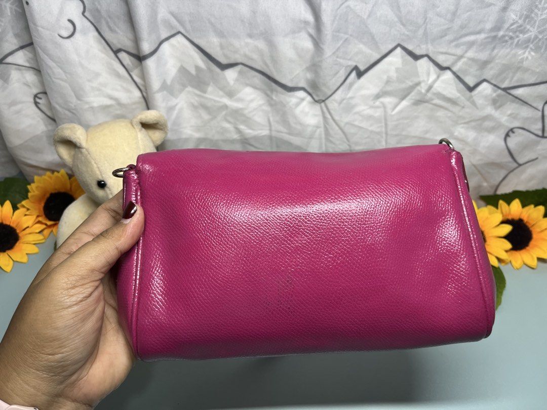 Coach Ruby Pink Leather Crossbody Bag with Silver Chain (Category: Cross-body Bags) located in Liloan. Submitted by sakurumifinds2809 (Listing ID 1460354947, Image 3). Description: - Cute pink leather crossbody bag - Silver chain strap - Silver turn-lock clasp - Small and compact, ideal for essentials - Perfect for night outs or casual wear - Features a nice leather sheen.