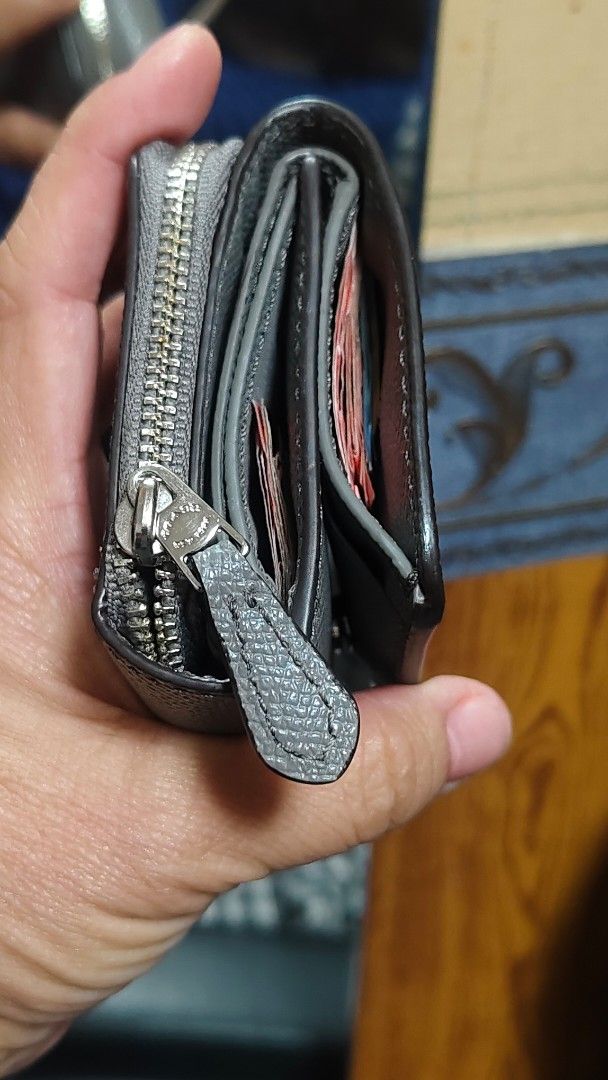 Coach Small Zip Around Wallet - Grey Pebble Leather (Category: Wallets & Card holders) located in Davao. Submitted by warmdeer-4ae1 (Listing ID 1460462305, Image 3). Description: - Brand: Coach - Material: Grey pebble leather - Style: Small zip around wallet - Features: Side coin zip pocket, ample card slots, bill compartments - Hardware: Silver - Size: Good for everyday use.