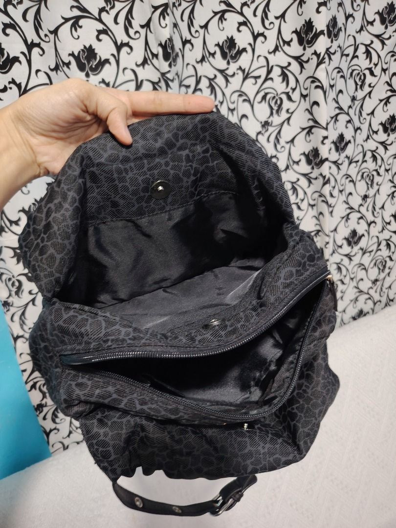 Coeur Deaux Black Leopard Print Shoulder Bag (Category: Shoulder Bags) located in Manila. Submitted by theshopandsmile (Listing ID 1460445340, Image 3). Description: - Brand: Coeur Deaux - Color: Black with subtle leopard print - Closure: Top zipper - Material: Leather trim and handles - Interior: Multiple compartments - Style: Shoulder bag - Features: Spacious, great for everyday use.