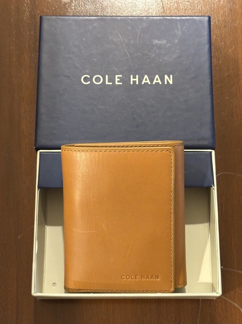 Cole Haan Brown Leather Trifold Wallet (Category: Wallets & Card Holders) located in Pasig City. Submitted by shopgirl101 (Listing ID 1460388998, Image 2). Description: - Brand: Cole Haan - Material: Genuine Brown Leather - Style: Trifold Wallet - 9 card slots - Includes: Original box and authenticity card - Ideal for: Everyday use Brand new with box Price is still negotiable MOP: Gcash, bank transfer. Shipping fee to be paid by the buyer. Lalamo