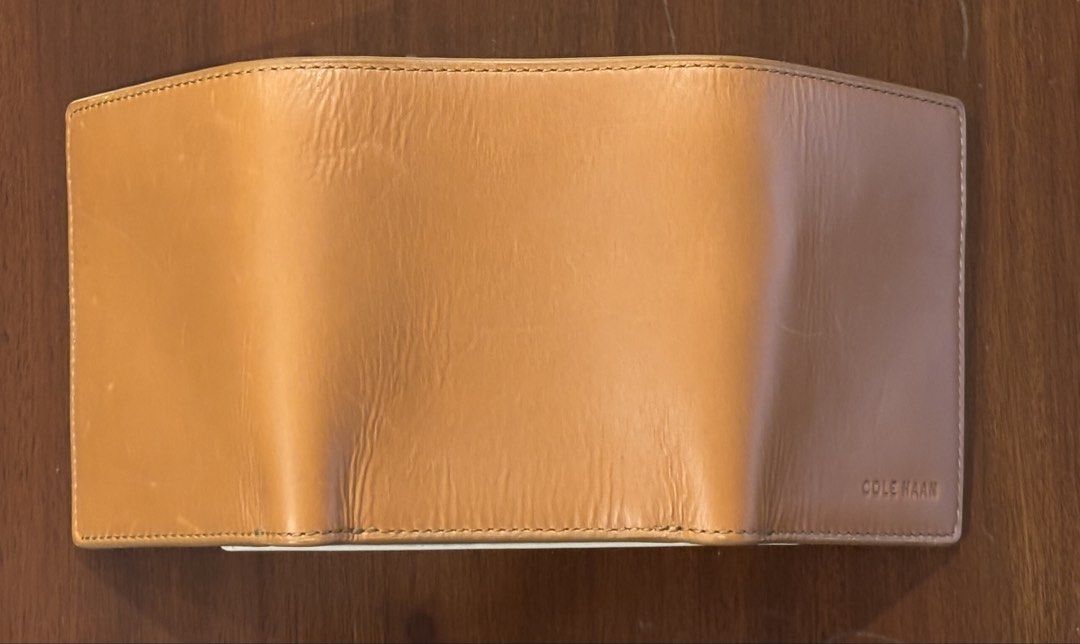 Cole Haan Brown Leather Trifold Wallet (Category: Wallets & Card Holders) located in Pasig City. Submitted by shopgirl101 (Listing ID 1460388998, Image 3). Description: - Brand: Cole Haan - Material: Genuine Brown Leather - Style: Trifold Wallet - 9 card slots - Includes: Original box and authenticity card - Ideal for: Everyday use Brand new with box Price is still negotiable MOP: Gcash, bank transfer. Shipping fee to be paid by the buyer. Lalamo
