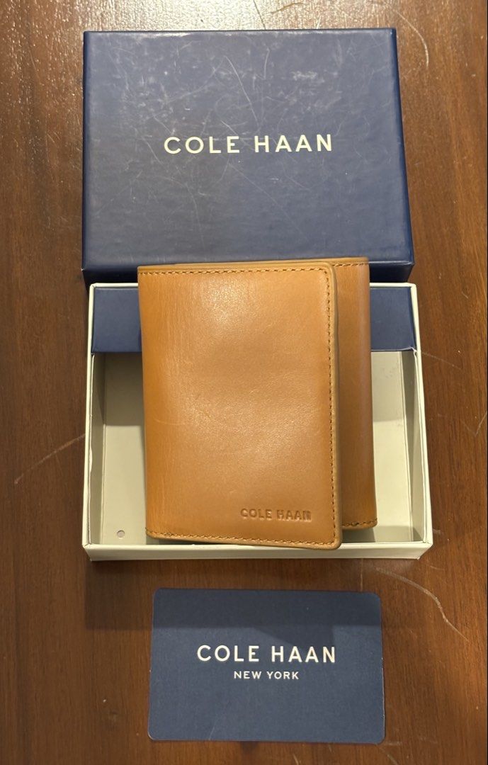 Cole Haan Brown Leather Trifold Wallet (Category: Wallets & Card Holders) located in Pasig City. Submitted by shopgirl101 (Listing ID 1460388998, Image 1). Description: - Brand: Cole Haan - Material: Genuine Brown Leather - Style: Trifold Wallet - 9 card slots - Includes: Original box and authenticity card - Ideal for: Everyday use Brand new with box Price is still negotiable MOP: Gcash, bank transfer. Shipping fee to be paid by the buyer. Lalamo