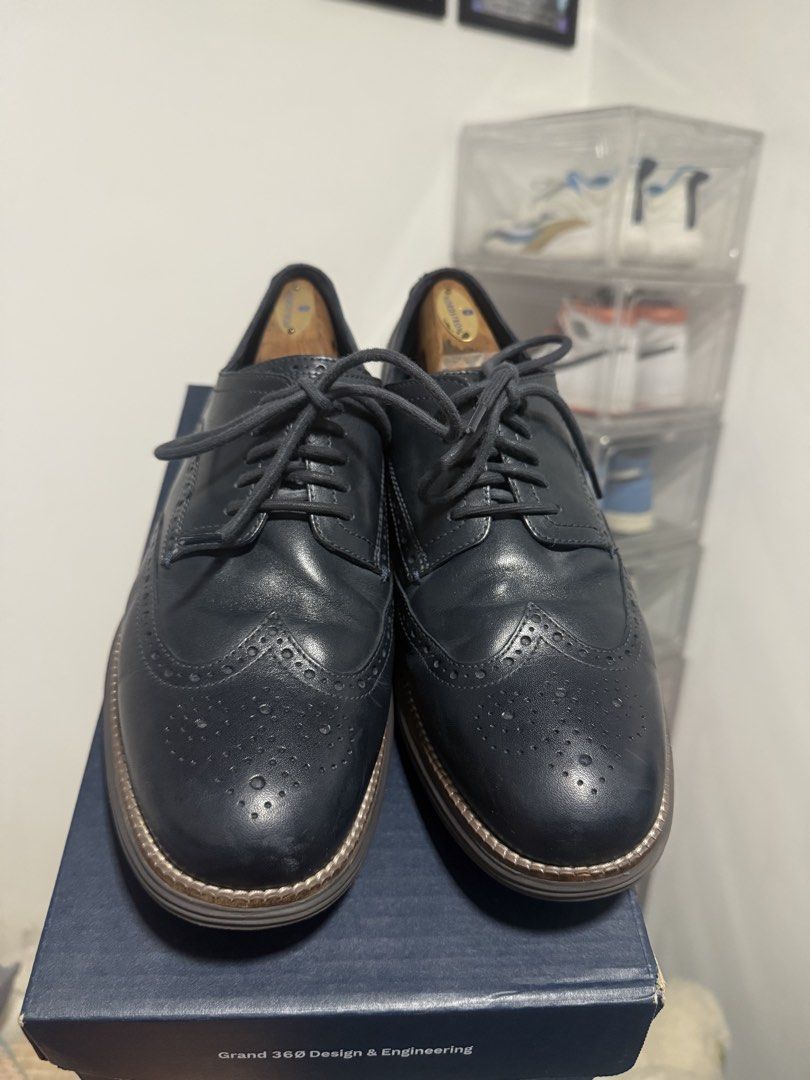 Cole Haan Grand 360 Design & Engineering Oxfords (Category: Dress Shoes) located in Manila. Submitted by riyhun (Listing ID 1460367566, Image 2). Description: - Cole Haan Oxfords - Color: Dark Blue/Grey - Style: Wingtip Brogue Detailing - Closure: Lace-up - Sole: Comfortable FlowerFoam - Includes: Original Box and Shoe Trees - Versatility: Perfect for dressing up or down.