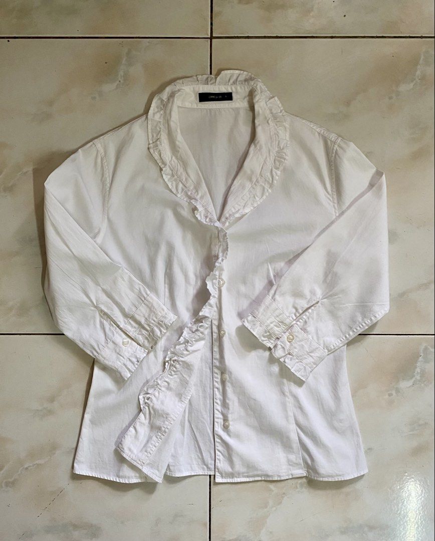 COMME ÇA ISM White Ruffled Blouse (Category: Blouses) located in Davao. Submitted by dollhouse_co (Listing ID 1460383227, Image 2). Description: - White Ruffled Blouse - Great condition / like new - Size: Small to Medium - Length: 57.4cm - Sleeves: 38.5cm MOD: Meet-up / Maxim / J&T MOP: GCash / RCBC .