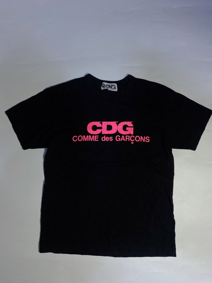 Comme des Garçons CDG pink Logo (Category: Tshirts & Polo Shirts ) located in Manila. Submitted by streetw1se.ph (Listing ID 1460398613, Image 1). Description: CDG pink logo shirt Width:20 Length:27 Shoulder:19 Sleeve length:8 Hem:20.5 (Measured in inches) -No issue -Good overall .