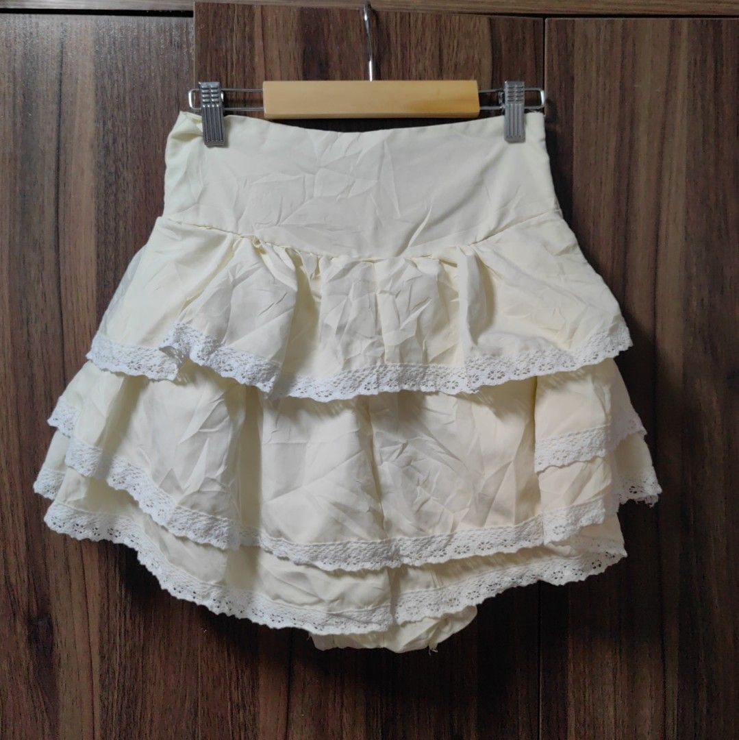 Coquette Fairy Ruffled Layer Skort (Category: Skirts) located in Taguig. Submitted by chielatte (Listing ID 1460355743, Image 2). Description: 000128 light yellow, high-waisted tiered ruffle mini skirt with delicate white lace trim and built-in bloomer shorts in a kawaii style W24xL13.