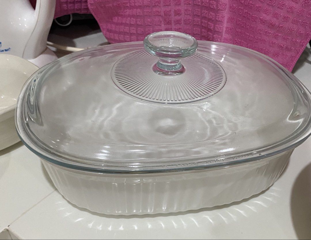 Corningware White Ceramic Baking Dishes with Glass Lids (Category: Bakeware) located in Mendez-Nunez. Submitted by BeYOUtifulStuffsGalore (Listing ID 1460503846, Image 3). Description: - Set of 7 white ceramic baking dishes - Includes large rectangular dish with glass lid - Includes smaller round dish with glass lid - Includes medium oval dish - Includes small round dish - Easy to clean - Ideal for casseroles, roasts, and desserts.