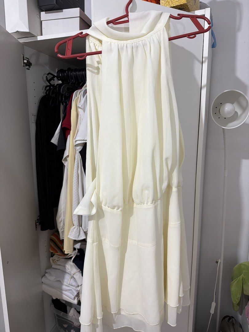 Cream Halter Neck Dress (Category: Dresses) located in Manila. Submitted by capsulefinds (Listing ID 1460436274, Image 1). Description: - Loose sides so best worn with body tape :) - Elegant cream halter neck dress - Flowy material with a flattering gathered waist - Beautiful layered hemline - Ideal for special events, parties, or gatherings - Designed for a great fit and beautiful drape.