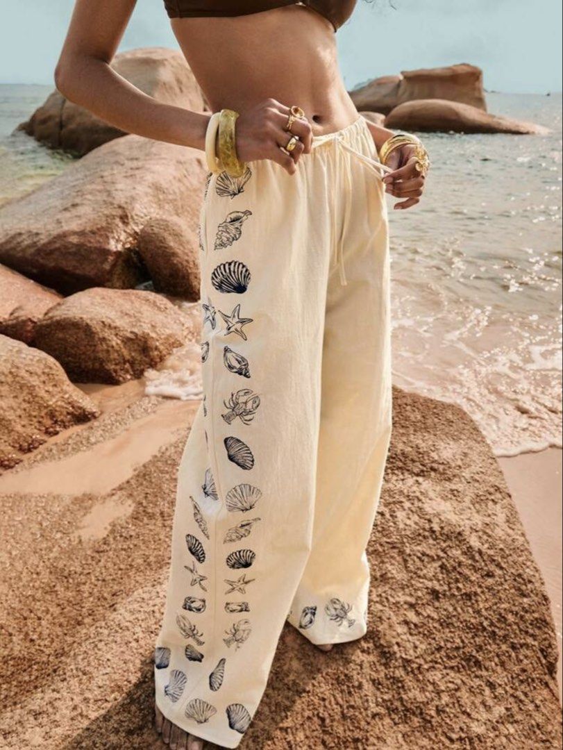 Cream Wide Leg Pants with Shell Print (Category: Other Bottoms) located in Cebu City. Submitted by mariz_cebu (Listing ID 1460308023, Image 1). Description: Pants only perfect for Beach outfit - Cream colored wide leg pants - Fun navy blue shell and lobster print on sides and hem - Comfortable drawstring waist - Perfect for beach days or casual outings - Versatile styling with bikini tops or light shirts.