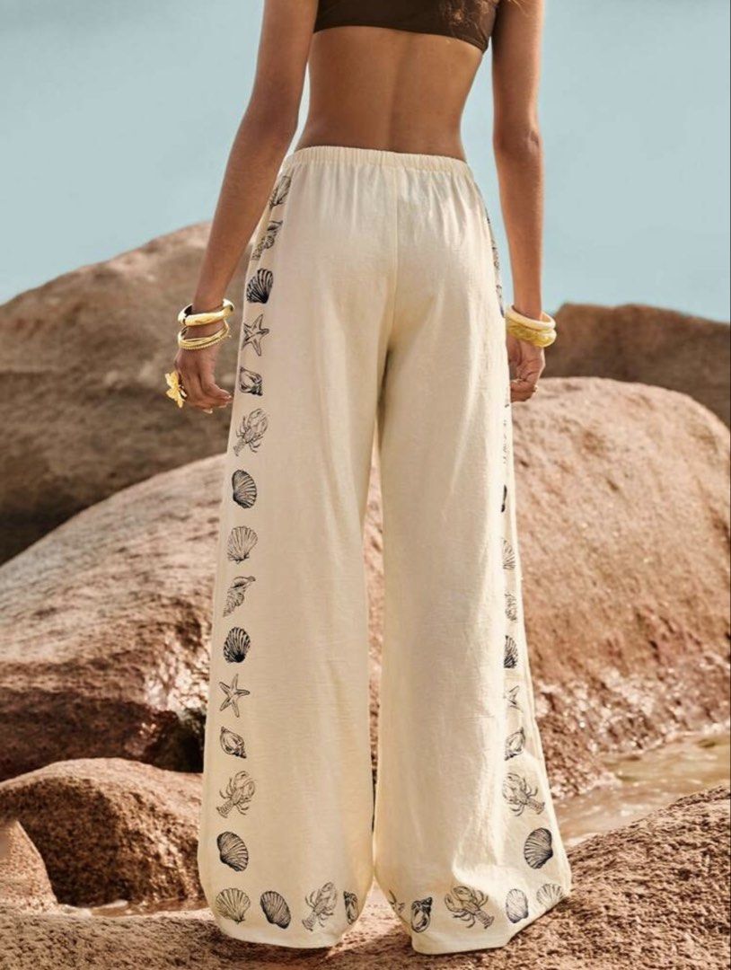 Cream Wide Leg Pants with Shell Print (Category: Other Bottoms) located in Cebu City. Submitted by mariz_cebu (Listing ID 1460308023, Image 3). Description: Pants only perfect for Beach outfit - Cream colored wide leg pants - Fun navy blue shell and lobster print on sides and hem - Comfortable drawstring waist - Perfect for beach days or casual outings - Versatile styling with bikini tops or light shirts.