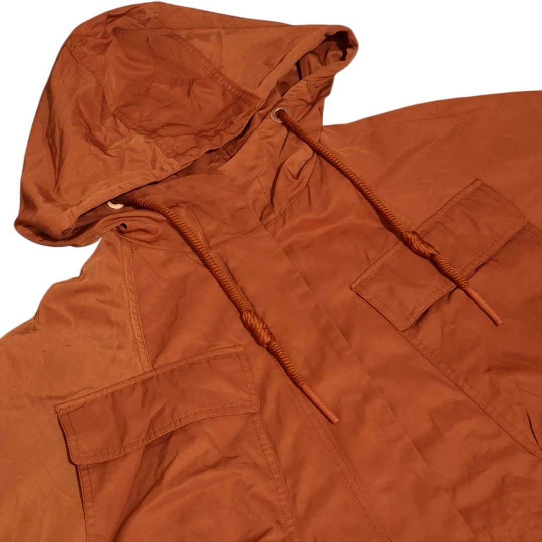 Cropped Hooded Utility Jacket with Pockets (Category: Coats, Jackets and Outerwear) located in Pasig City. Submitted by m_r_g (Listing ID 1460440180, Image 3). Description: - Rust orange hooded jacket - Cropped style - Drawstring hem and hood - Two chest pockets - Button cuffs - Lightweight material - Ideal for casual wear and layering.