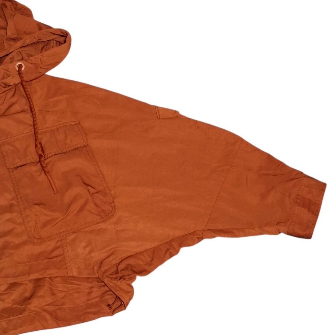 Cropped Hooded Utility Jacket with Pockets (Category: Coats, Jackets and Outerwear) located in Pasig City. Submitted by m_r_g (Listing ID 1460440180, Image 2). Description: - Rust orange hooded jacket - Cropped style - Drawstring hem and hood - Two chest pockets - Button cuffs - Lightweight material - Ideal for casual wear and layering.