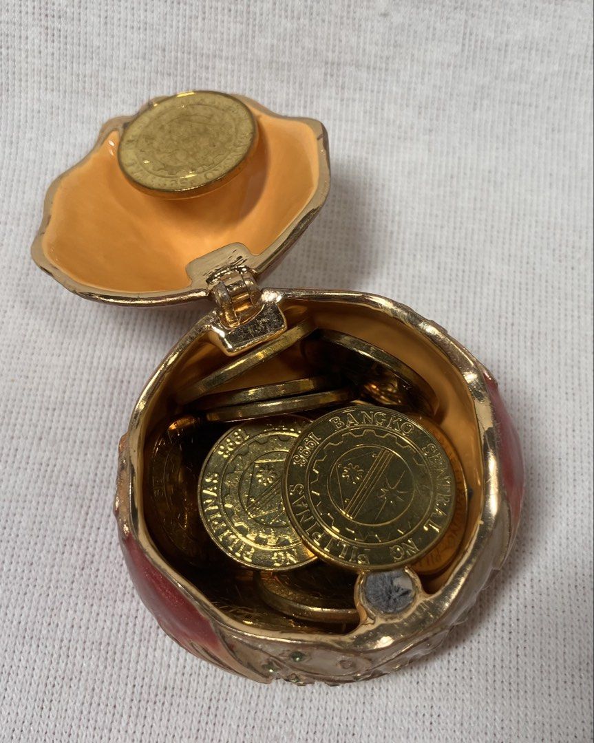 Cute Chicken Trinket Box with Coins (Category: Character Goods) located in Mandaluyong City. Submitted by coolmeybab (Listing ID 1460385172, Image 3). Description: - Adorable chicken-shaped trinket box - Hinged lid opens to reveal storage space - Comes with several gold-colored coins - Ideal for storing small treasures or as a decorative piece - Unique and charming design.