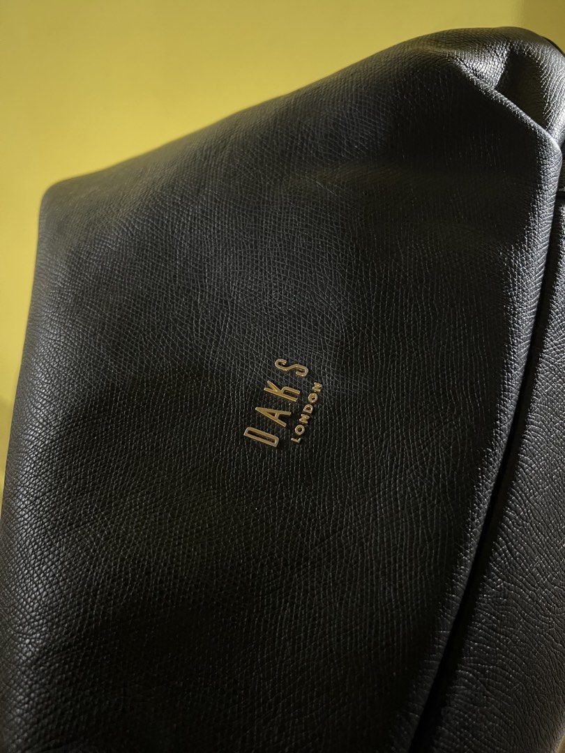DAKS London Black Leather Shoulder Bag (Category: Shoulder Bags) located in Quezon City. Submitted by ara.etcetera (Listing ID 1460314061, Image 3). Description: - Authentic DAKS London black leather shoulder bag - Features a stylish textured leather finish - Elegant gold hardware details - Generously spacious interior for all your essentials - Ideal for everyday use, ready for its new owner - No rubs, no bakbak but needs cleaning sa loob ng bag.