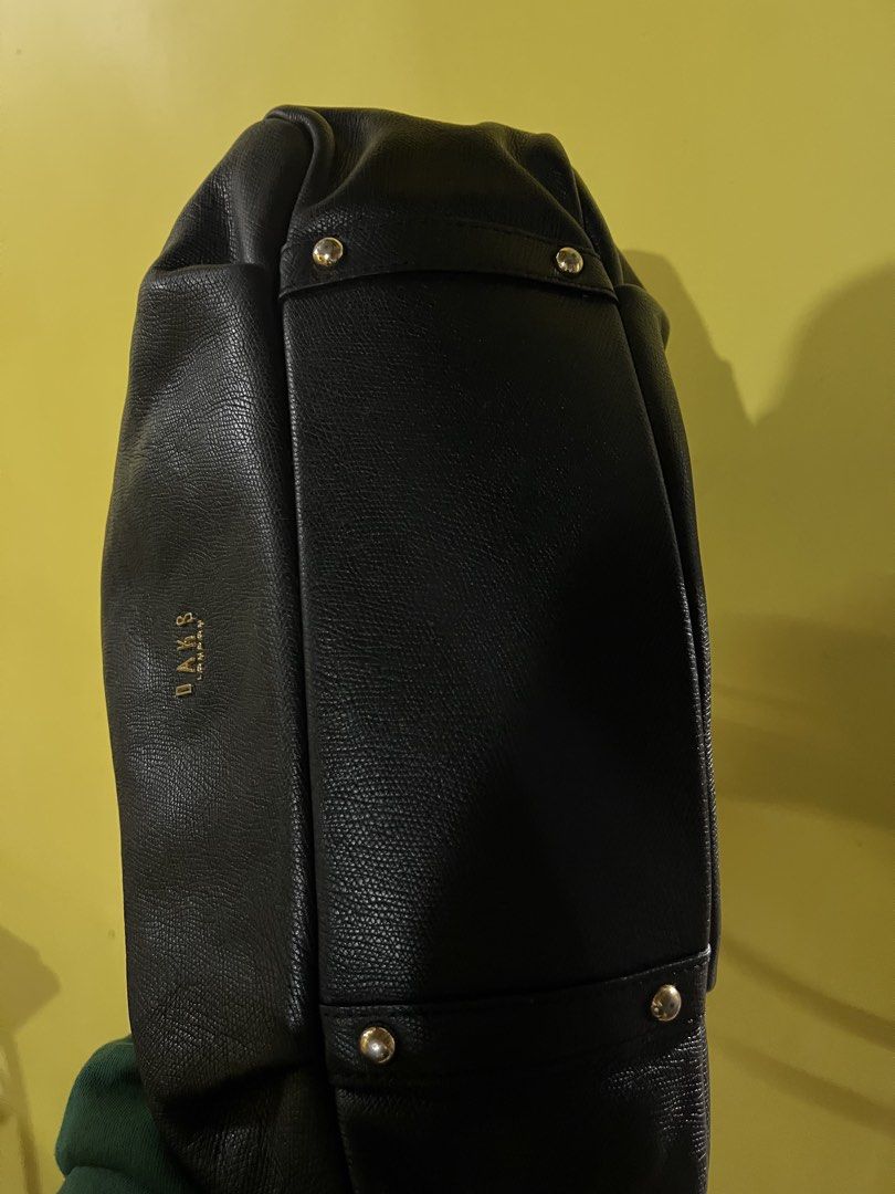 DAKS London Black Leather Shoulder Bag (Category: Shoulder Bags) located in Quezon City. Submitted by ara.etcetera (Listing ID 1460314061, Image 2). Description: - Authentic DAKS London black leather shoulder bag - Features a stylish textured leather finish - Elegant gold hardware details - Generously spacious interior for all your essentials - Ideal for everyday use, ready for its new owner - No rubs, no bakbak but needs cleaning sa loob ng bag.