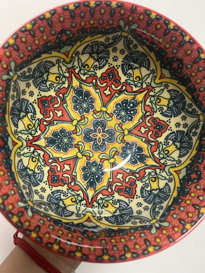 Decorative Ceramic Bowl with Intricate Pattern (Category: Vases & Decorative Bowls) located in Dasmarinas. Submitted by purpleboxmidori (Listing ID 1460471930, Image 3). Description: - Beautiful ceramic bowl with a vibrant, detailed pattern. - Solid red exterior. - Approximately 20cm in diameter. - Ideal for serving food or as a decorative accent. - Adds a pop of color to your table. - Dishwasher safe for easy cleaning..