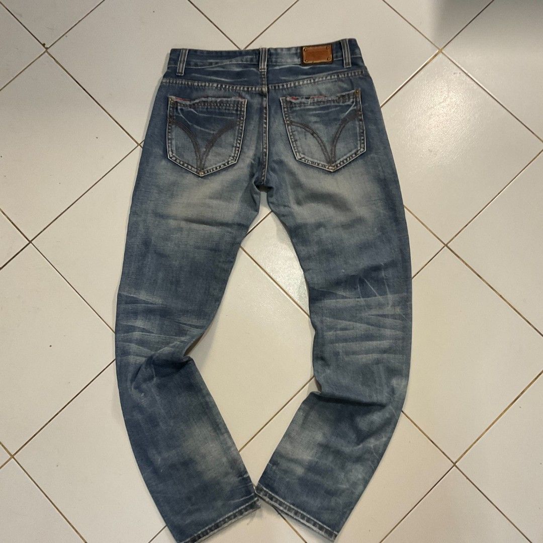 D&G Jeans Distressed Blue Denim (Category: Jeans) located in Morong. Submitted by rusty.vault (Listing ID 1460457209, Image 2). Description: - Authentic Blue D&G Jeans - Distressed wash with stylish rips and fading - Classic button fly closure - Unique stitching details on back pockets - Ideal for a cool, casual look.
