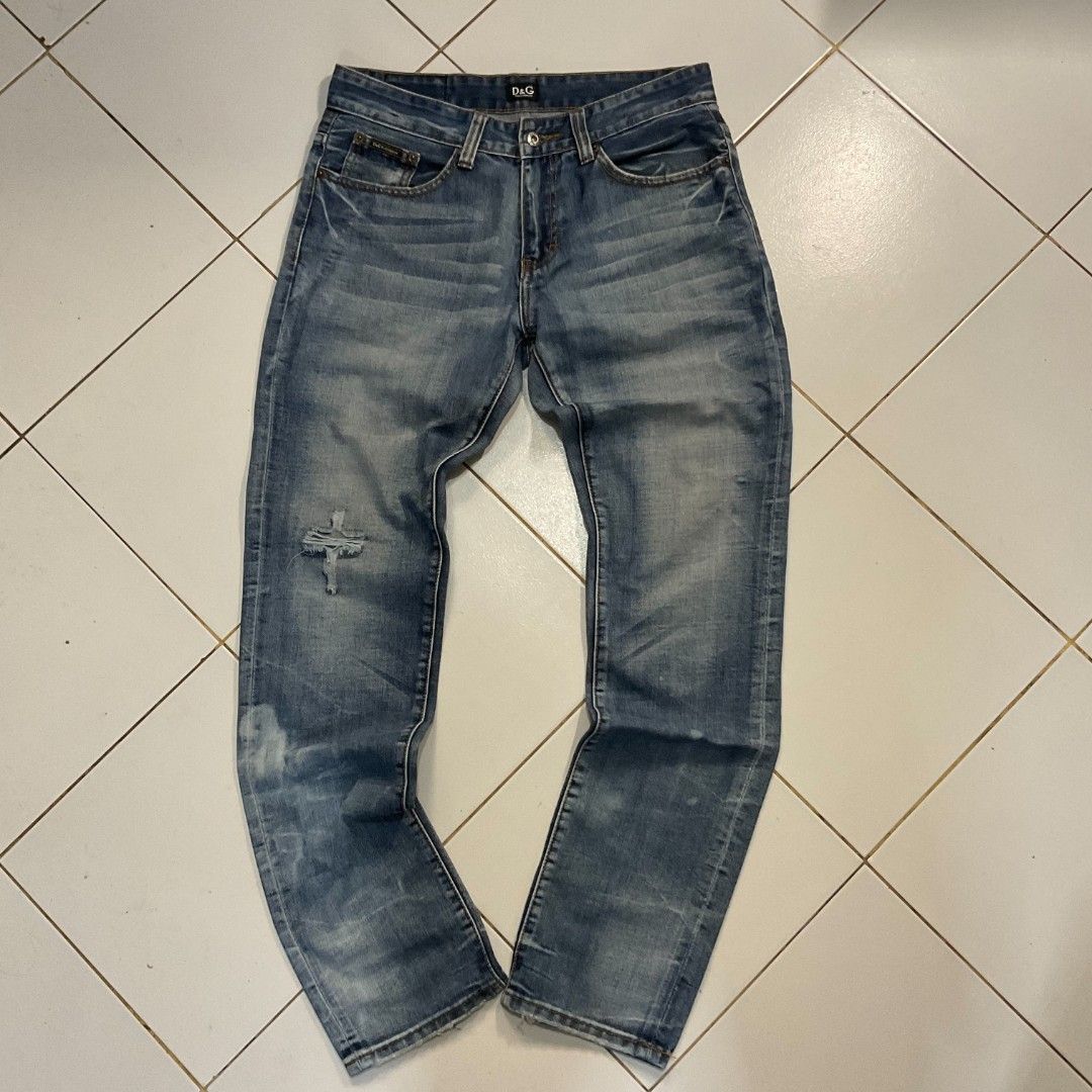 D&G Jeans Distressed Blue Denim (Category: Jeans) located in Morong. Submitted by rusty.vault (Listing ID 1460457209, Image 1). Description: - Authentic Blue D&G Jeans - Distressed wash with stylish rips and fading - Classic button fly closure - Unique stitching details on back pockets - Ideal for a cool, casual look.