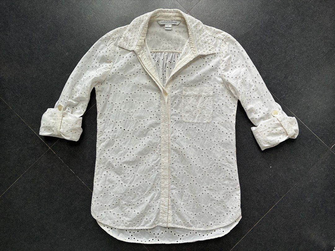 Diane von Furstenberg long-sleeved button down shirt (Category: Longsleeves) located in Batangas. Submitted by mumbee (Listing ID 1460428675, Image 3). Description: Diane von Furstenberg long-sleeved button down shirt. Cotton/silk blend fabric in cream with eyelet detail. With option to button up the sleeves halfway. With security logo for authenticity. Size 0 Fits XS-S Like new, no flaws. RFS: Too many shirts.