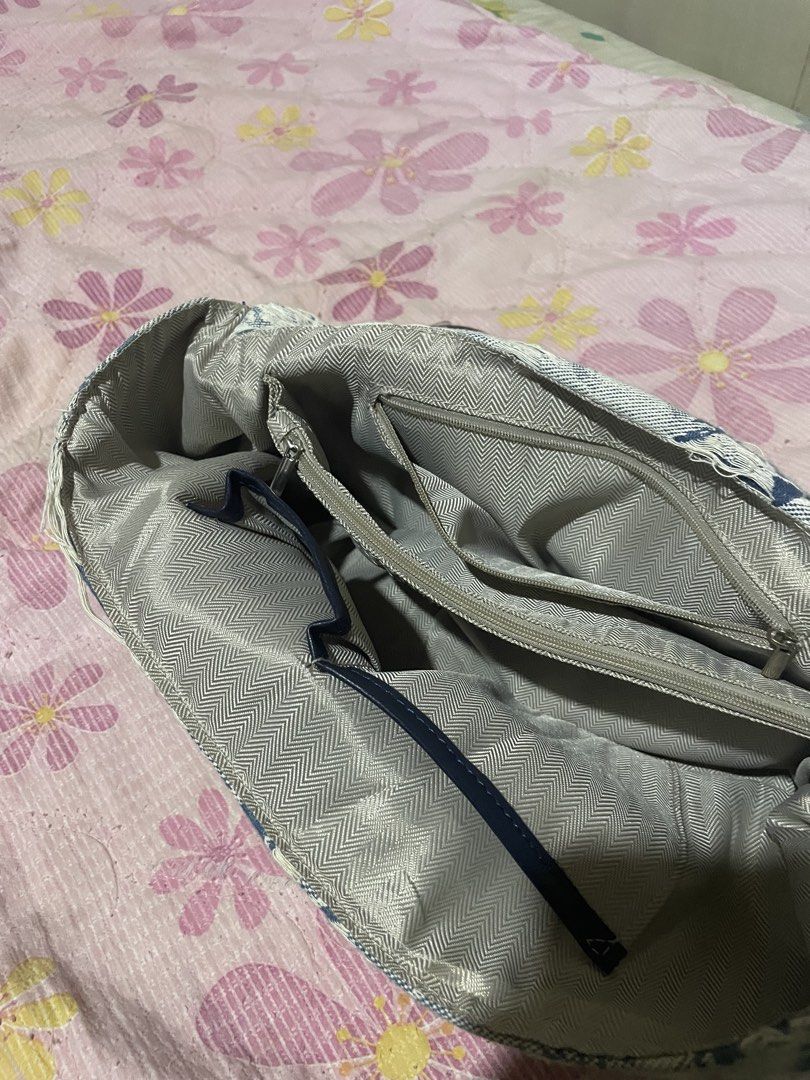 Diesel Denim Shoulder Bag with Chain Strap (Category: Shoulder Bags) located in Davao. Submitted by houkaygoods (Listing ID 1460321364, Image 2). Description: - Diesel shoulder bag inspired - Durable denim material with a unique abstract pattern - Prominent large 'D' logo on the front - Stylish silver chain strap - Multiple interior compartments for organization - Includes a secure zip pocket inside - Ideal for everyday wear and versatile styling