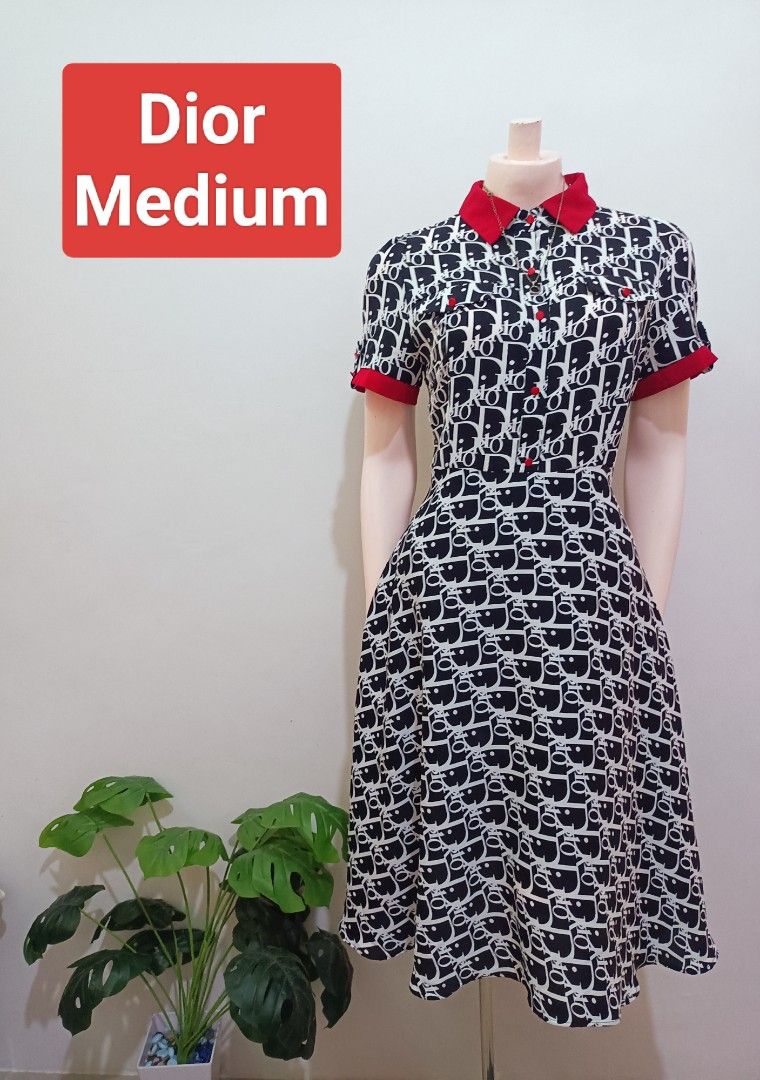 Dior Monogram Shirt Dress Medium (Category: Dresses) located in Angeles City. Submitted by leichen57360 (Listing ID 1460350534, Image 1). Description: - Classic Dior monogram print dress - Collared neckline with button-up front - Short sleeves with stylish red trim - Flared skirt for a flattering silhouette - Perfect for a chic, casual look - Size: Medium.