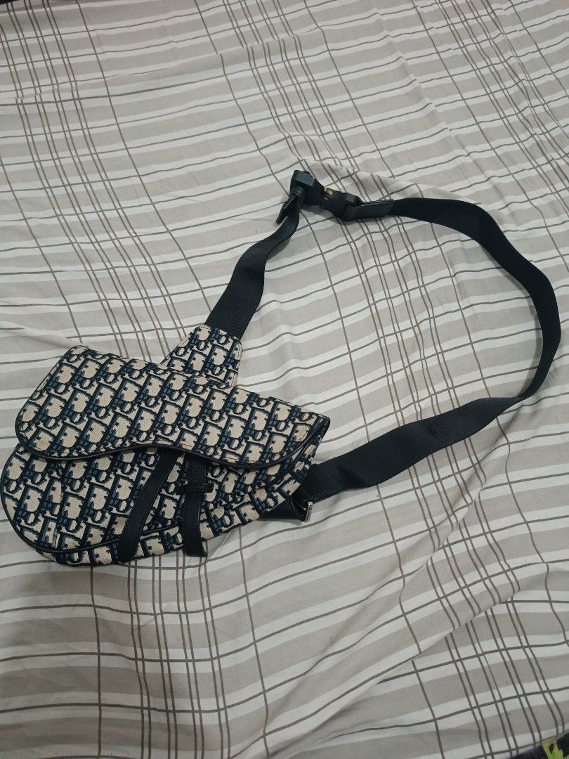 DIOR OBLIQUE SADDLE BAG BLACK IN CANVAS (Category: Luxury Bags & Wallets) located in Legazpi City. Submitted by paul-galvez420. (Listing ID 1460309944, Image 1). Description: DIOR OBLIQUE SADDLE BAG BLACK IN CANVAS GOOD AS NEW CONDITION NO ISSUE.