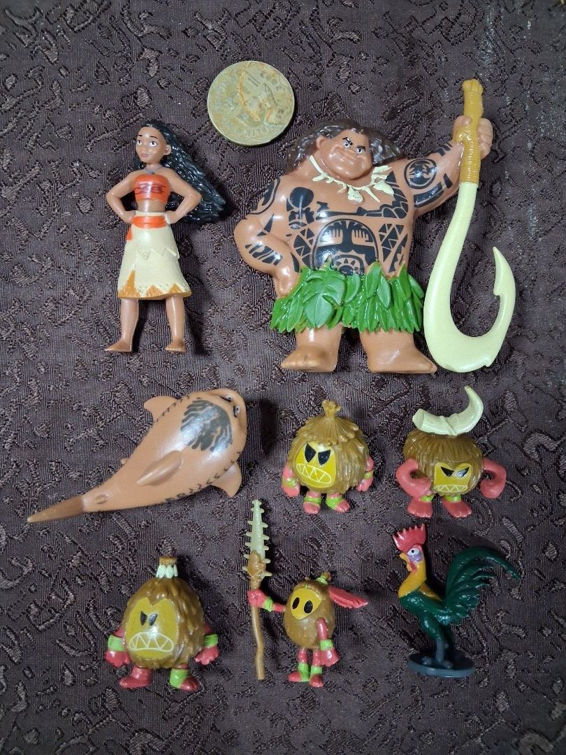 Disney Moana Toy Figures Set (Category: Figurines & Statues) located in Marikina City. Submitted by misskawaii (Listing ID 1460311979, Image 1). Description: - Features Moana, Maui (human and shark figures), four Kakamoro, and Hei Hei - Please see photos for size reference (coin not included in the purchase)..