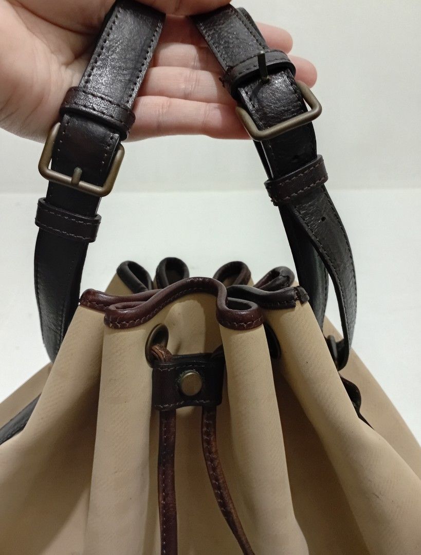 Distressed Burberry OG Canvas and Leather Drawstring Bag (Category: Luxury Bags & Wallets) located in Navotas City. Submitted by ms.soulana (Listing ID 1460411801, Image 3). Description: PreOwned WellUsed Authentic Vintage distressed Burberry OG Canvas & Leather Drawstring Bucket Bag Cream,brown Large - Color: Beige canvas with signature check pattern - Trim & Straps: Dark brown leather - Closure: Drawstring with leather ties - Interior: One zip 