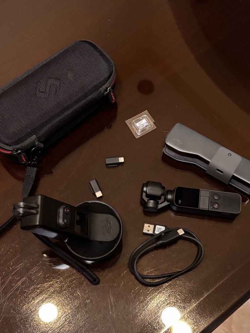 DJI OSMO POCKET 1ST EDITION (Category: Cameras) located in Manila. Submitted by yyangdul (Listing ID 1460494071, Image 1). Description: - DJI Osmo Pocket 1st Edition - Condition: Good as new - Full Inclusions: Original Case, Waterproof Casing, Charger, USB-C Dongle, Lightning Dongle - Includes a 16GB SanDisk SD Card (Never used) - Perfect for capturing stable, high-quality videos and photos - Ships from Pampanga via J&T, LBC, or local delivery (M