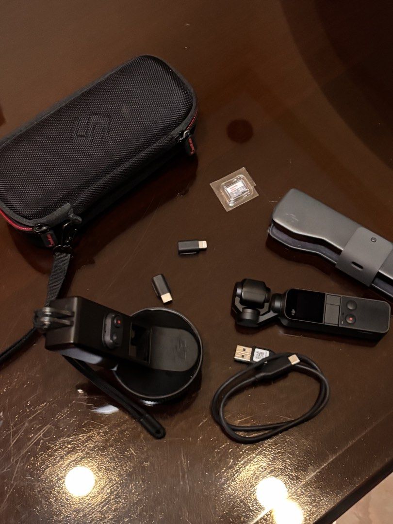 DJI OSMO POCKET 1ST EDITION (Category: Cameras) located in Manila. Submitted by yyangdul (Listing ID 1460494071, Image 2). Description: - DJI Osmo Pocket 1st Edition - Condition: Good as new - Full Inclusions: Original Case, Waterproof Casing, Charger, USB-C Dongle, Lightning Dongle - Includes a 16GB SanDisk SD Card (Never used) - Perfect for capturing stable, high-quality videos and photos - Ships from Pampanga via J&T, LBC, or local delivery (M