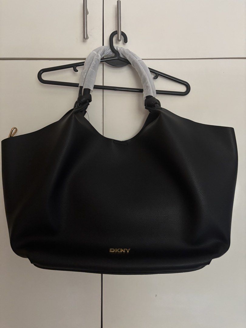 DKNY Paula commuter tote bag (Category: Tote Bags) located in San Pedro. Submitted by treasuresbyisabelle (Listing ID 1460334154, Image 1). Description: Large Black Gold harware.