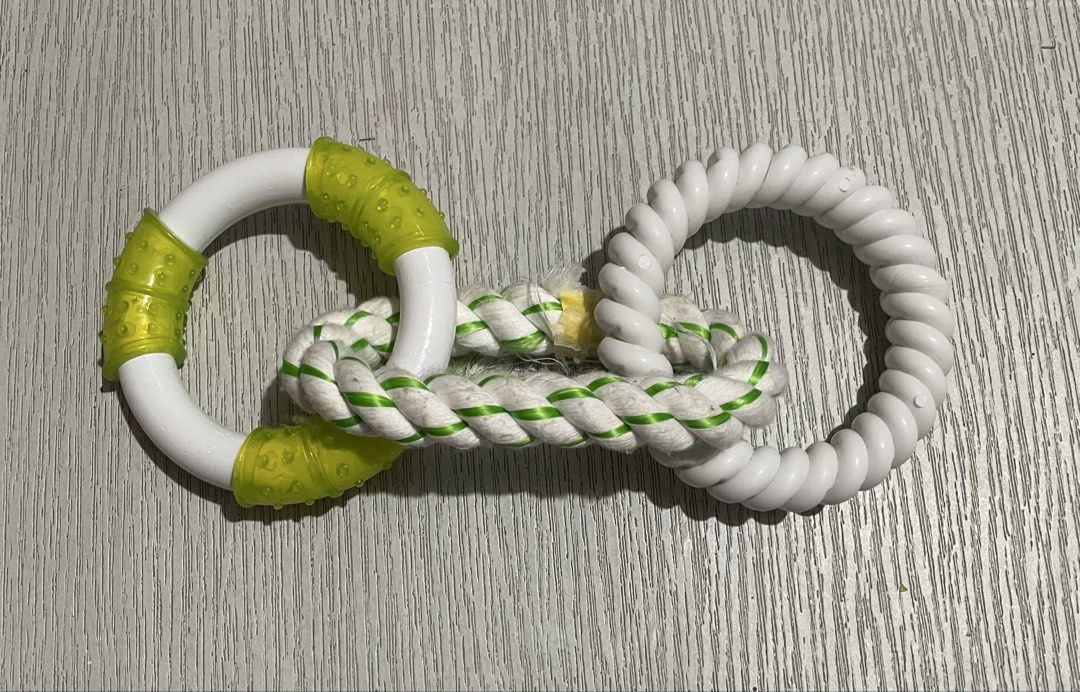 Dog Rope Toy with Rings (Category: Action & Battle Toys) located in Caloocan City. Submitted by jetcon (Listing ID 1460441318, Image 1). Description: - Interactive dog toy with two durable rings and a sturdy rope. - Features a textured green silicone grip ring for enhanced play. - Includes a twisted white plastic ring for added chewing fun. - Ideal for tug-of-war games and satisfying chewing needs. - Keeps your medium to large dog entertained and