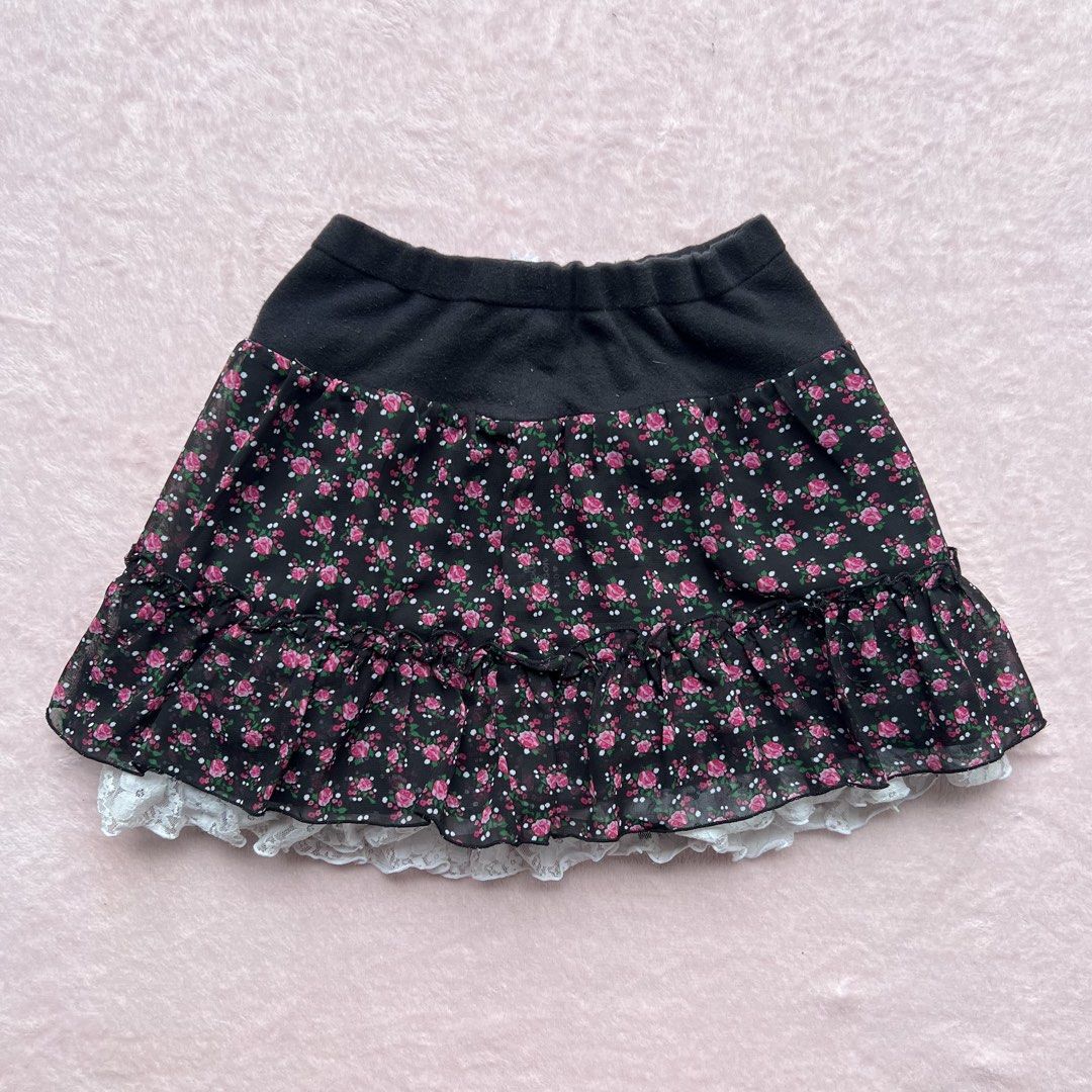 Dolly Ribbon Skirt Size 160 (Category: Skirts) located in Cavite. Submitted by alestair_ (Listing ID 1460455811, Image 1). Description: - Cute tiered skirt from Dolly Ribbon - Black top with floral print chiffon overlay - White lace trim at the hem - Comfortable elastic waistband - reversible - Size 160 - Versatile for everyday or special occasions.