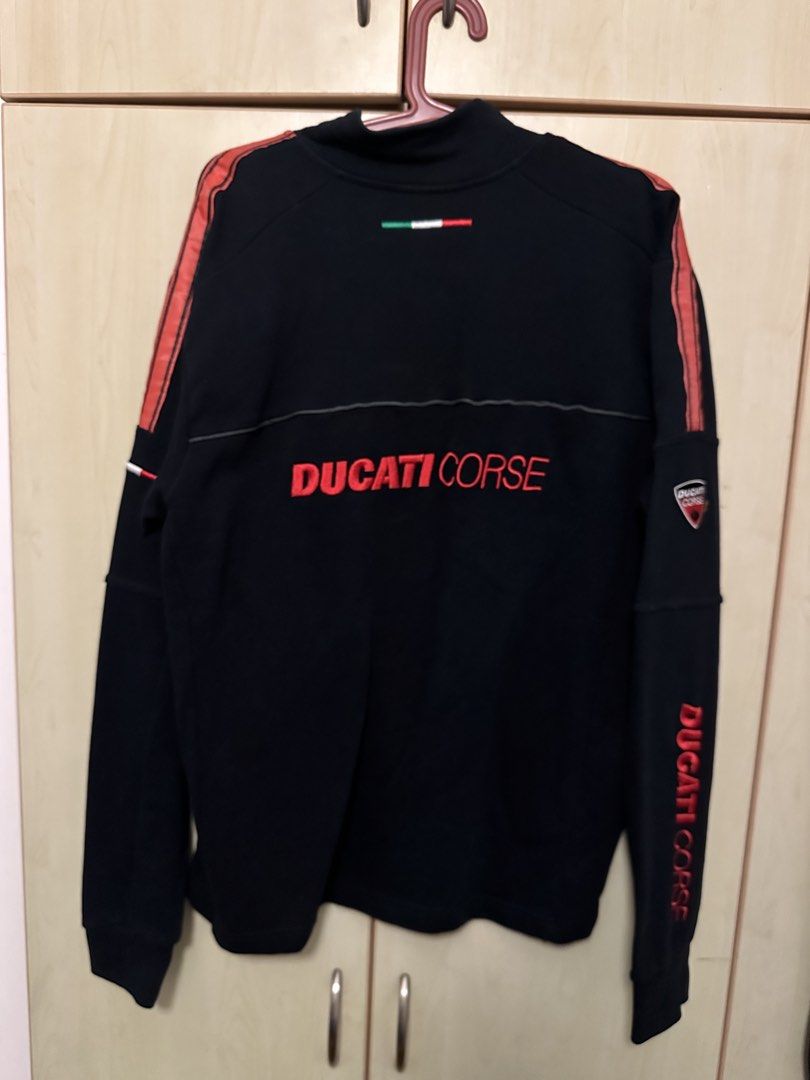 Ducati Corse Black half zip jacket Size M (Category: Coats, Jackets and Outerwear) located in Quezon City. Submitted by mancave_stuff (Listing ID 1460429458, Image 2). Description: - Authentic Ducati Corse team half zip - Features Embroidered iconic Ducati Corse logo on chest, back and sleeve - Stylish red stripe detail on sleeves - Convenient quarter zip neck - Size Medium (M) W24” x L27” - Perfect for any Ducati enthusiast -will pass as new -Pe