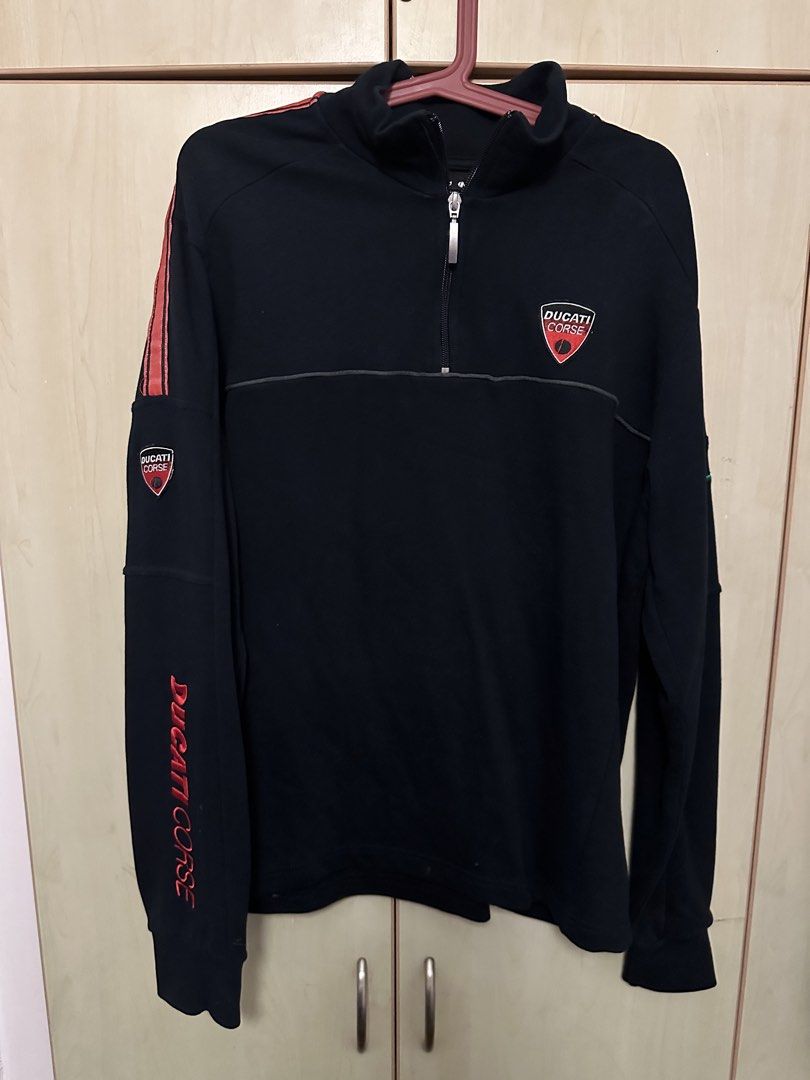 Ducati Corse Black half zip jacket Size M (Category: Coats, Jackets and Outerwear) located in Quezon City. Submitted by mancave_stuff (Listing ID 1460429458, Image 1). Description: - Authentic Ducati Corse team half zip - Features Embroidered iconic Ducati Corse logo on chest, back and sleeve - Stylish red stripe detail on sleeves - Convenient quarter zip neck - Size Medium (M) W24” x L27” - Perfect for any Ducati enthusiast -will pass as new -Pe