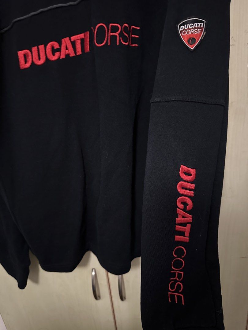 Ducati Corse Black half zip jacket Size M (Category: Coats, Jackets and Outerwear) located in Quezon City. Submitted by mancave_stuff (Listing ID 1460429458, Image 3). Description: - Authentic Ducati Corse team half zip - Features Embroidered iconic Ducati Corse logo on chest, back and sleeve - Stylish red stripe detail on sleeves - Convenient quarter zip neck - Size Medium (M) W24” x L27” - Perfect for any Ducati enthusiast -will pass as new -Pe