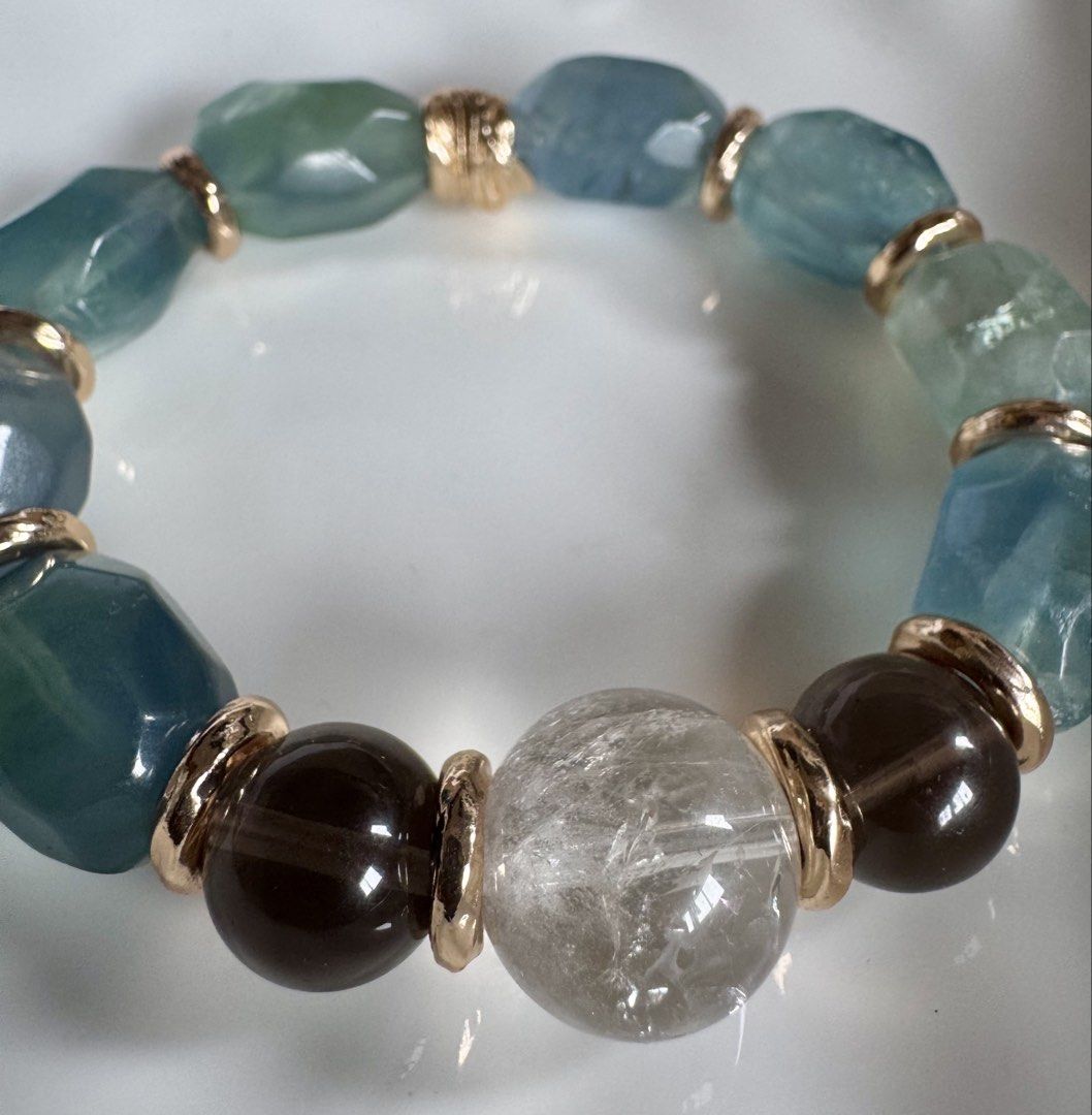 Duo bao fluorite natural stone bracelet (Category: Bracelets) located in Quezon City. Submitted by nics006 (Listing ID 1460354429, Image 2). Description: Combination of fluorite, smoky quartz, and clear quartz .A powerful crystal blend for mental clarity, stress relief, and energy amplification. Crystal Benefits Fluorite: Clears mental fog, brings order to chaos, and helps you focus. Smoky Quartz: Absorbs negative energy, relieves stress, and gro