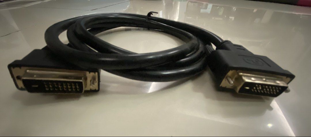 DVI-D Dual Link Cable for Video Output (Category: Cables & Adaptors) located in Imus. Submitted by 9teen.87 (Listing ID 1460472806, Image 1). Description: - Black DVI-D Dual Link Cable - Connects PC to Monitor/Display - Supports High-Resolution Video - Gold-Plated Connectors for Optimal Signal - Approximately 6 Feet Long - Tested and Confirmed Working.