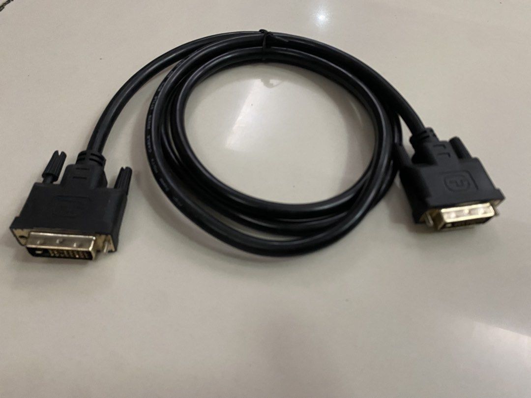 DVI-D Dual Link Cable for Video Output (Category: Cables & Adaptors) located in Imus. Submitted by 9teen.87 (Listing ID 1460472806, Image 2). Description: - Black DVI-D Dual Link Cable - Connects PC to Monitor/Display - Supports High-Resolution Video - Gold-Plated Connectors for Optimal Signal - Approximately 6 Feet Long - Tested and Confirmed Working.