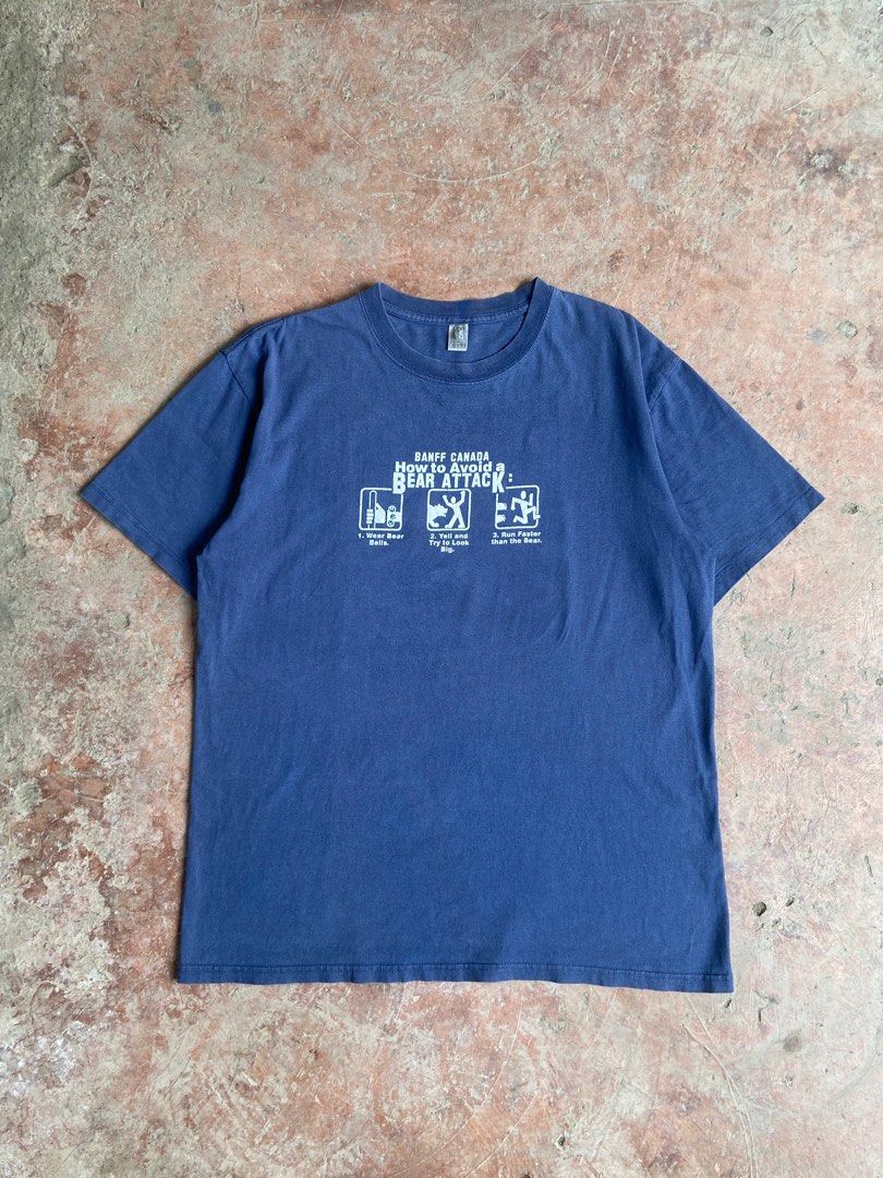 Early 2000’s Banff Canada Bear Attack Humor Tee Thai Boot (Category: Tshirts & Polo Shirts ) located in Tagum. Submitted by manifesto.arch (Listing ID 1460378245, Image 1). Description: Needs Wash Issue: Hairlines Dimes: 21x28 Large Can vouch on any platform .