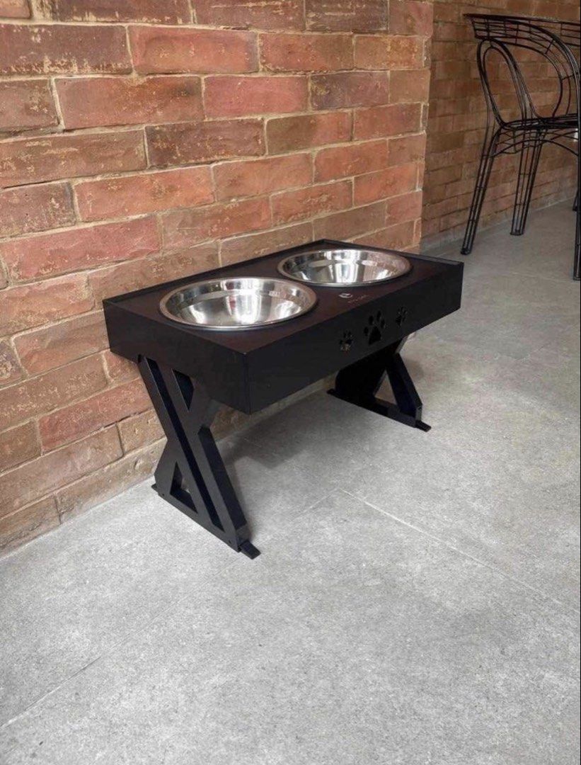 Elevated Pet Feeder Stand (Category: Homes & Other Pet Accessories) located in Manila. Submitted by rynaaaaa__ (Listing ID 1460366770, Image 3). Description: 3 Height Levels Dimensions:440mm*288mm Bowl: Almost 8 inches deep Color: Grey and Black FREE 2 stainless steel bowl already- Stylish elevated feeder for pets - Includes two durable stainless steel bowls - Sturdy black stand with cute paw print cutouts - Promotes better digestion and posture 