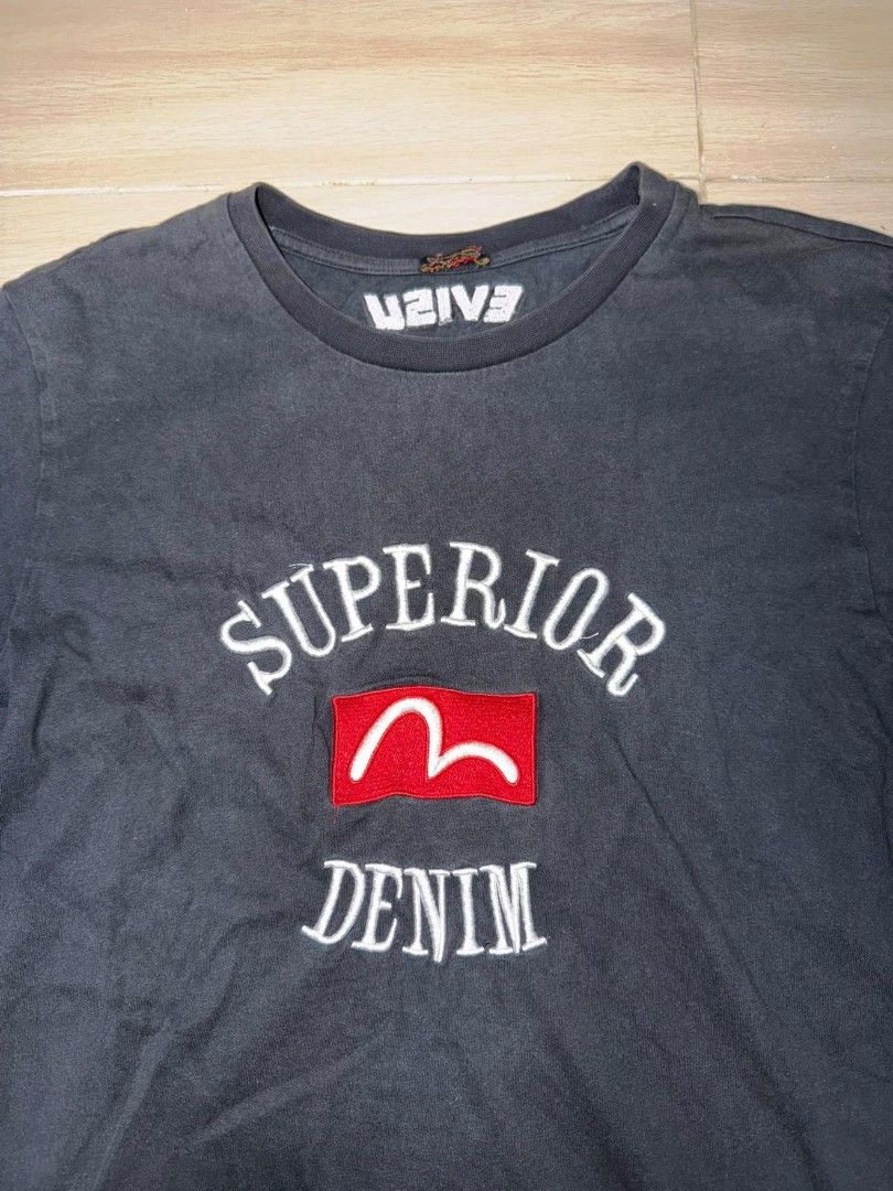 Evisu Superior Denim T-shirt (Category: Tshirts & Polo Shirts ) located in Cainta. Submitted by hermosooo (Listing ID 1460432496, Image 2). Description: - Black Evisu T-shirt - Features 'Superior Denim' graphic - Iconic Evisu seagull logo detail - Short sleeves - Crew neck - Ideal for casual wear.