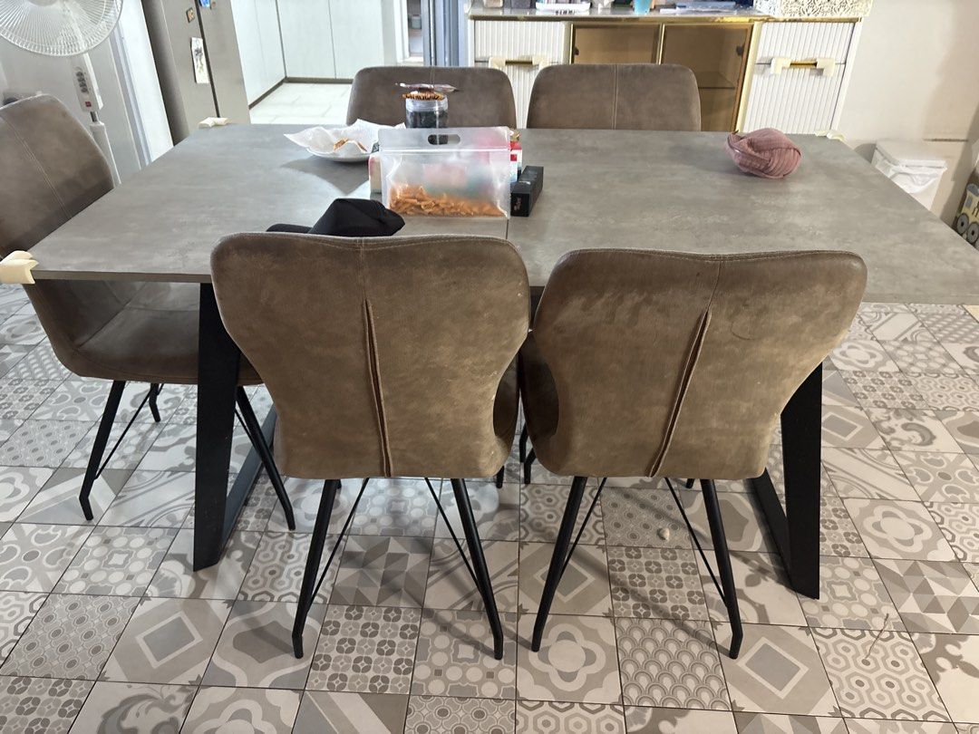 Extendable Dining Table (Category: Tables & Sets) located in Singapore. Submitted by shopper.licious15 (Listing ID 1460306510, Image 1). Description: - Modern concrete-look dining table - Includes 6 taupe upholstered chairs - Table features black metal legs - Chairs have textured taupe fabric and black metal legs - Comfortably seats 6 people - Ideal for family meals and entertaining guests - to clear asap.