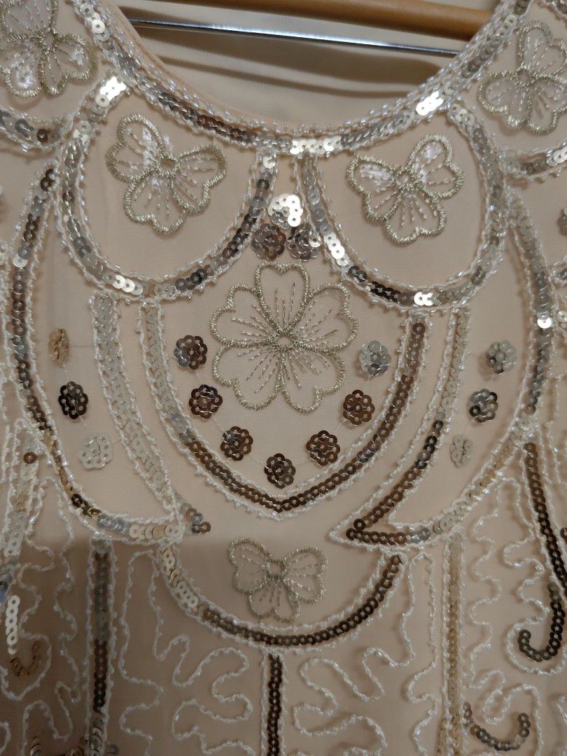 Fairy Top Sequin Mesh (Category: Sleeveless) located in Taguig. Submitted by chielatte (Listing ID 1460366197, Image 2). Description: B42xL26 00132 nude sleeveless tank top adorned with intricate silver sequins, beaded floral patterns, and a sheer scalloped hem..