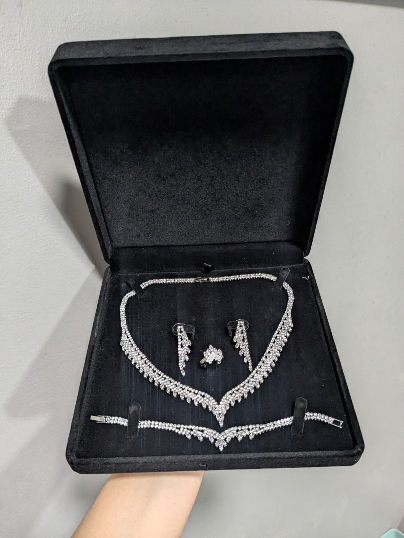 Falls & Crown White CZ Wedding Accessories Set (Category: Necklaces) located in Quezon City. Submitted by nnncorner (Listing ID 1460496044, Image 2). Description: Falls & Crown Tennis Cubic Zirconia Jewelry Set perfect for wedding or formal event hypoallergenic non tarnished Japan clasp closure Earrings Length - 1.5 inch Ring Size - 7 Necklace Length - 23 cm ( locked ) Pendant - 1 inch Bracelet - fits 17-19 cm wrist it sparkles in person and eleg