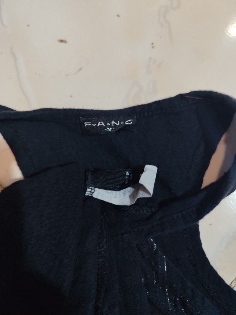 F.A.N.G. TANK TOP (Category: Sleeveless) located in Pagadian. Submitted by hidden_gems. (Listing ID 1460436629, Image 2). Description: L 25 W 17 COLOR 10/10 ISSUE SA PIC.