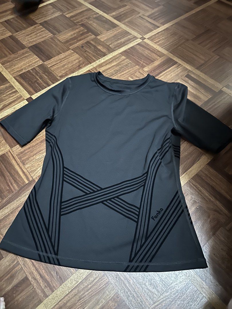 Fanka Grey Athletic T-shirt (Category: Activewear) located in Davao. Submitted by fashiondeclutter11 (Listing ID 1460479437, Image 1). Description: - Brand: Fanka - Color: Grey - Style: Athletic T-shirt - Sleeves: Short - Neckline: Crew Neck - Design: Criss-cross stripe detail on sides - Occasion: Workout or casual wear - Material: Comfortable and breathable.