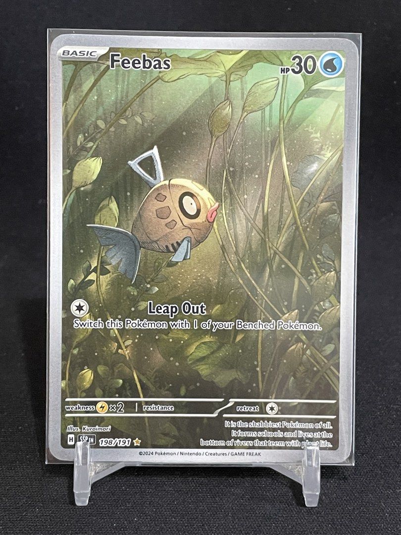 Feebas Surging Sparks Art Rare (Category: Raw Singles) located in Muntinlupa City. Submitted by shiganshina_collectibles (Listing ID 1460374671, Image 1). Description: Modern Pokemon Card Loc: Quezon City MoP: GCash or Maya MoD: LBC or Lalamove.