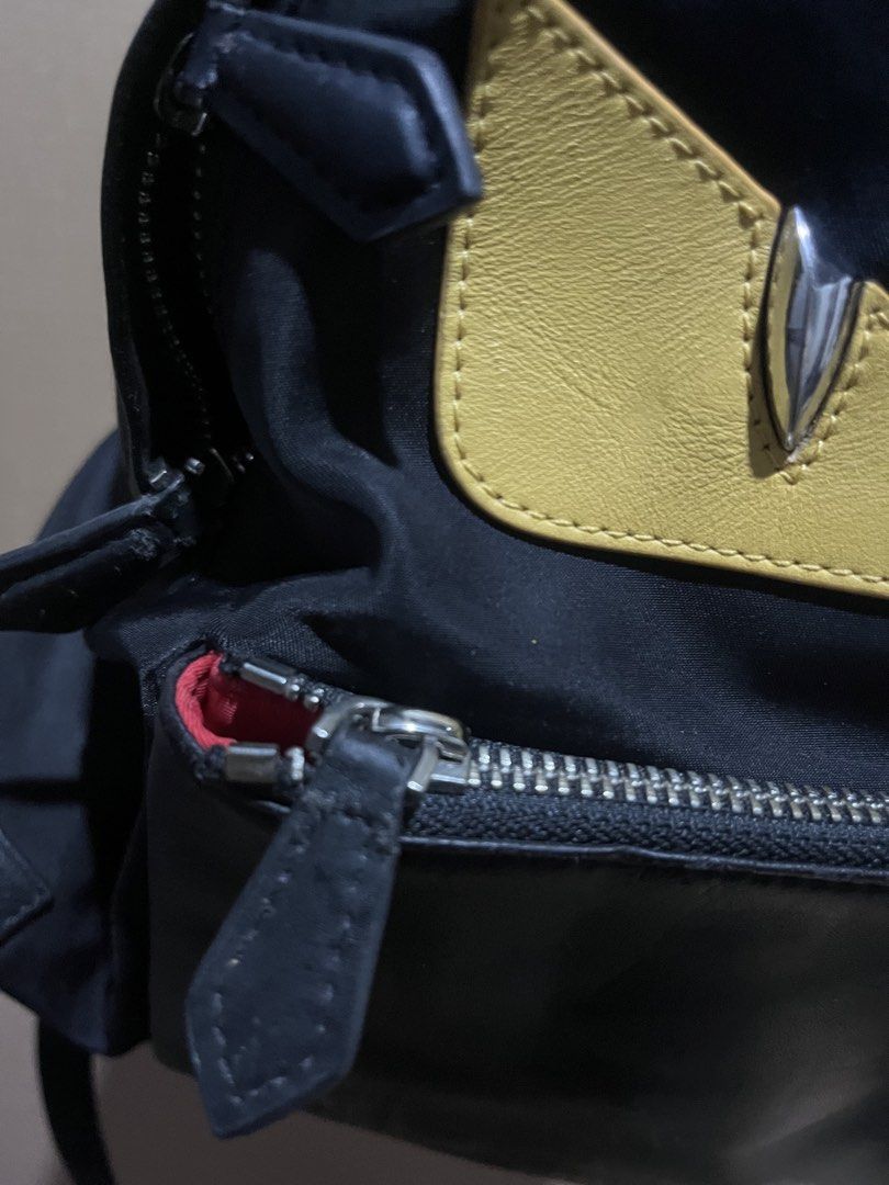 Fendi Monster Eyes Backpack Black Nylon Yellow Leather (Category: Luxury Bags & Wallets) located in Manila. Submitted by madecuratedwithlove11 (Listing ID 1460418840, Image 3). Description: - Fendi backpack -will send the issue via pm (rubs, minor sign of use in puller) - Black nylon material - Iconic Fendi monster eyes design with yellow leather and silver accents - Zipper closure - Interior Fendi Roma tag - Perfect for everyday use - Shows some