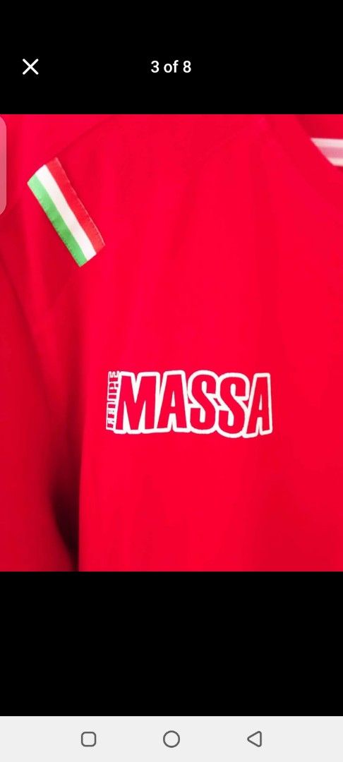 Ferrari Massa T-shirt Red (Category: Tshirts & Polo Shirts ) located in Manila. Submitted by jef09754 (Listing ID 1460376797, Image 3). Description: - Red t-shirt featuring Massa and Ferrari logos - Italian flag on one sleeve, Brazilian flag on the other - Ideal for Formula 1 enthusiasts - Show your support for Felipe Massa and Scuderia Ferrari - Great for casual wear.